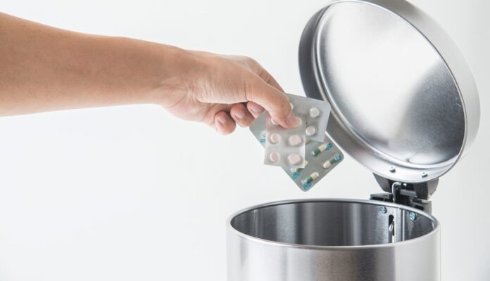 throwing away medecine in trashcan